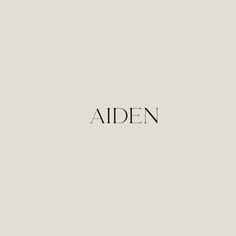 the word aiden written in black ink on a gray background with an image of two people