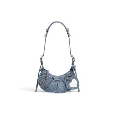 Women's Le Cagole Xs Shoulder Bag Denim in Blue | Balenciaga US Balenciaga Store, Denim Shoulder Bag, Heart Mirror, Denim Shoulder Bags, Balenciaga Logo, Frayed Denim, Balenciaga Bag, Denim Bag, Luxury Handbags