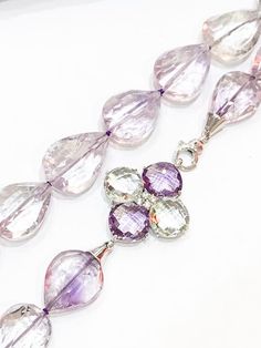 Stunning quality lilac Amethyst stones, faceted and shaped like teardrops, finished with a large 925 silver clasp set with faceted green amethyst and lilac amethyst stones arranged as a flower.Measuring approximately 22" in length. All jewellery is packed in beautiful gift pouches.The item will be securely packaged and sent promptly after payment is received. Please note if you require a quicker method of delivery we can also arrange that.Thank you so much for looking at my shop!Please contact m Lilac Amethyst, Amethyst Stones, Silver Chain Style, Ruby Necklace, Labradorite Beads, Amethyst Jewelry, Teardrop Necklace, Green Amethyst, Photo Bracelet