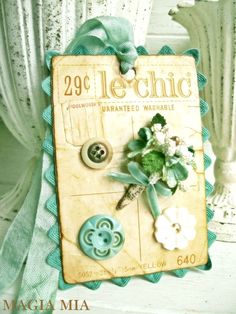 a card with buttons and flowers on it