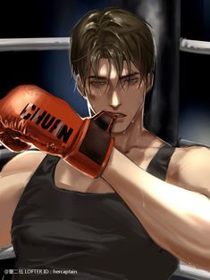 a man in black shirt and red boxing gloves