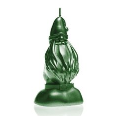 a green glass figurine sitting on top of a white surface