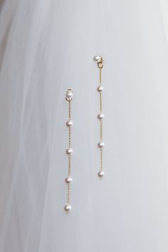 Crystal embellished earrings Gold toned Sterling silver post Push closure at back Steal the show in our stunning Gaia earrings. Featuring a pearl embellished, drop design. They're the on-trend luxe life look we are living for and are perfect for a wedding or special birthday celebration. Team them with a satin mini dress for a head-turning look. MATERIAL ALLOY/PEARLS Silver Linear Earrings With Pearl Charm For Wedding, Pearl White Dangle Earrings With Pearl Chain, Elegant Dangle Pearl Chain Earrings, Elegant Pearl Chain Dangle Earrings, Formal Pearl Linear Earring, Formal Pearl Linear Single Earring, Formal Pearl Single Linear Earring, Elegant Pearl Charm Chandelier Dangle Earrings, Elegant Pearl Charm Chandelier Earrings