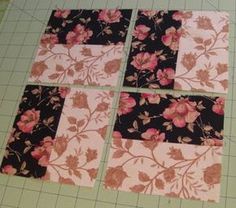 four square pieces of fabric with pink flowers on them, laid out on a cutting board