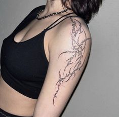 a woman with a tattoo on her arm