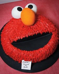 the cake is decorated like an elmo face