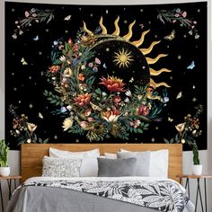 a bedroom with a large tapestry on the wall and bed in front of it,