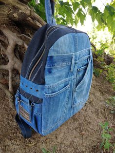 Stylish backpack manufactured from jeans. A basic fabric backpack with three external pockets. There are two side pockets . The inside of the bag has a polyester lining and internal pockets,perfect for keeping valuables. Back,front part and bottom are sealed. Very soft and lightweight but durable. This backpack has enough space inside to carry all your necessaries. That's why it's so good for light walking or everyday use. It can be used in travel. CARE: hand wash or wash machine delicate cycle 40 degrees.  Note that the different colors of the computer screen may vary slightly. This backpack is out of stock. You can order a similar backpack but accurate playback is not possible. Also a similar backpack is in stock at the link: https://www.etsy.com/listing/1504966359/recycled-denim-blue-ba Denim Travel Backpack With Pockets, Travel Backpack With Pockets In Denim, Denim Backpack With Pockets For Everyday Use, Denim Backpack With Pockets, Standard Denim Backpack With Pockets, Recyceltes Denim, Fabric Backpack, Stylish Backpack, Fabric Wallet