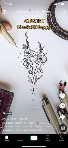 someone is drawing flowers on the paper with a pen and some other items around them