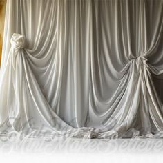 an image of a white curtain that is open