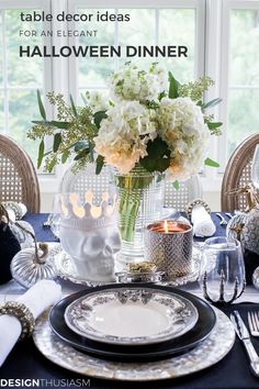 a table set for an elegant halloween dinner