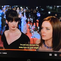 two women are on the television screen talking to each other