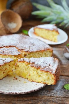 a cake is cut into pieces on a plate with one slice missing from the cake