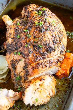 a roasting pan filled with chicken and vegetables