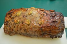 a piece of meat sitting on top of a cutting board