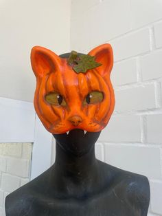 Therian mask pumpkin cat 🎃 * Mask out of hard paper mache * painted eyes still with good sight * 3D pumpkin optic * hand-painted * lined on the inside * clay nose with realistic texture and little shine * pumpkin leaf * comfortable to wear * not waterproof! * comes with a very little surprise <3 It is a hand made product so please be careful handling it. Do not pull on the fur, try to scrape off paint or anything else. You cannot send it back to me or get your money back if you do not like it. Halloween Masquerade Mask With Cat Design, Halloween Cat Design Mask For Costume Party, Halloween Cat Design Masks And Prosthetics With Cat Ears, Halloween Cat Ears Mask With Whiskers, Halloween Cat Design Masks And Prosthetics For Costume Party, Halloween Masquerade Masks With Whiskers, Clay Nose, Therian Masks, Pumpkin Leaf