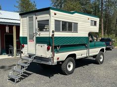 a truck with a camper attached to the back