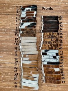 several different colors of fur on a wooden floor with numbers in the bottom right corner