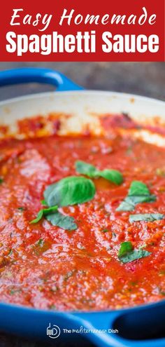 easy homemade spaghetti sauce in a blue pan with basil leaves on top and text overlay that reads easy homemade spaghetti sauce