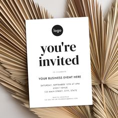 a white business card with the words you're invited on it