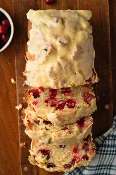 sliced loaf of cranberry bread on top of a cutting board