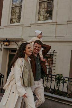 a man and woman are walking down the street