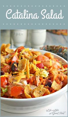 a white bowl filled with pasta and vegetables