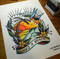 an image of a tattoo on paper that says life's a beach