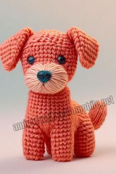 an orange crocheted dog sitting on top of a table