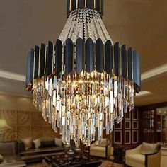 a chandelier hanging from the ceiling in a living room