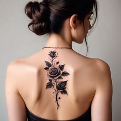 a woman with a rose tattoo on her back