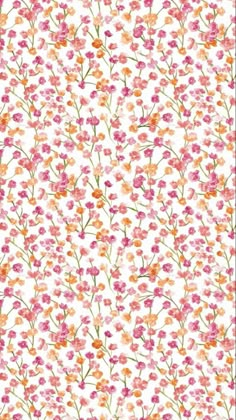 an orange and pink flower pattern on white paper