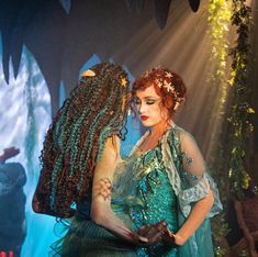 a woman dressed as merida from the little mermaid with her hair in braids