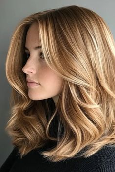 Woman with shoulder-length, wavy, golden blonde hair in a side profile. Honey Blonde Hair With Strawberry Highlights, Darkish Blonde Hair, Expensive Honey Hair Color, Golden Highlights Blonde Hair, Blond Honey Hair, Virgin River Mel Hair, Medium Length Honey Blonde Hair, Golden Brown Hair Honey Highlights, Blond Dore Miel