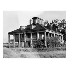 an old house sitting on top of a lush green field