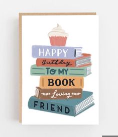 a birthday card with books stacked on top of each other