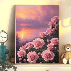 a painting of pink roses on a shelf next to a teddy bear