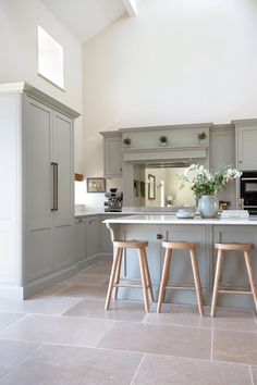 two stools are in front of the kitchen island