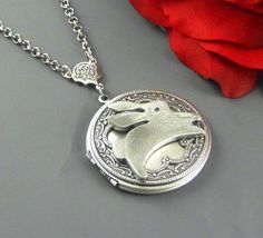 This woodland inspired locket is antique silver. Large round sterling silver plated locket is embellished with sterling silver plated lacy filigree and bunny charm. Locket is hanging from antique silver rosary link, and finished with silver chain and lobster clasp. Locket is 38 mm in size. It opens and has room for two photos inside. Please note: I DO NOT DO ENGRAVING OR INSERT PICTURES! Thanks for looking:) Victorian Silver Locket Necklace Gift, Silver Victorian Locket Necklace Gift, Vintage Silver Locket Necklace With Round Pendant, Silver Vintage Locket Necklace With Round Pendant, Victorian Silver Personalized Locket Necklace, Victorian Personalized Silver Locket Necklace, Ornate Handmade Silver Locket Necklace, Ornate Silver Handmade Locket Necklace, Silver Locket Necklace With Vintage Charm