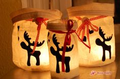 two mason jars decorated with reindeer silhouettes