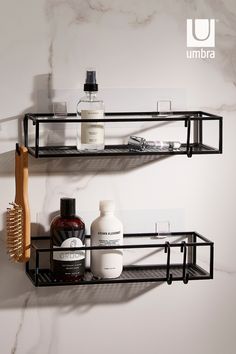 two black shelves with bottles and soaps on them