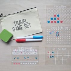 the travel game set is laid out with markers and pencils