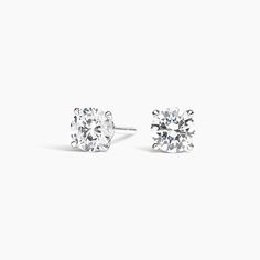 Claw Prong Round Diamond Stud Earrings. A beautifully matched pair of round diamonds are secured in an elegant, open basket with claw prongs. Earrings with a total carat weight of 1.00 carat or over will receive a guardian backing and earrings with a total carat weight under 1.00 carat will receive a push backing. Round Cut Diamond Earrings, Diamond Earrings Studs Round, Claw Prong, Diamond Stud Earrings, Diamond Stud, Accessories Jewelry Earrings, 3 Carat, Round Earrings, 1 Carat