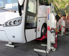 a bus is parked on the side of the road with it's door open