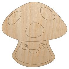 a wooden cutout of a mushroom with eyes