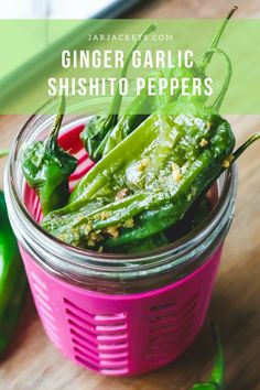 some green peppers in a pink container with the words ginger garlic shishito peppers