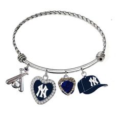 the new york yankees heart charm bracelet has three charms and is attached with a baseball hat