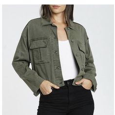 The Cove Is A Cropped Military Jacket. This Style In Sweet Bay Olive Features A Black And Gold Stripe On The Shoulder. Condition Is New With Tags. Jacket Is Flawed. It Has Discoloration On The Left Sleeve, Pen Marks. No Tears. Please Feel Free To Ask Questions Prior To Purchasing. Size: L Fabric: 98% Cotton / 2% Spandex Color: Olive Green Casual Khaki Cropped Jacket With Long Sleeves, Green Cropped Jacket With Pockets For Fall, Trendy Olive Outerwear With Pockets, Trendy Olive Long Sleeve Outerwear, Casual Long Sleeve Khaki Cropped Jacket, Olive Military Outerwear With Pockets, Cropped Military Jacket, Olive Military Cotton Outerwear, Dark Wash Denim Jacket