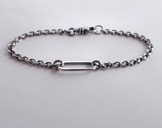 Oxidized sterling silver minimalist unisex chain bracelet with large link center and swivel clasp. Perfect for everyday wear! Choose your length: 5 ½, 6, 6 ½, 7, 7 ½, 8, 8 ½, 9, 9 ½ inches. Unisex - minimalist masculine styling great for men or women. Center sterling silver link is 7 x 17mm (5/8 inch long) and the main bracelet chain is a 2.8mm sterling silver round cable chain. High quality swivel lobster clasp makes sure the bracelet is never twisted. Bracelet is medium oxidized and polished/b Classic Sterling Silver Bracelet With Lobster Clasp For Everyday, Modern Link Chain Bracelet With Sterling Silver Clasp, Sterling Silver Chain Bracelet For Everyday, Classic Sterling Silver Bracelet With Cable Chain For Everyday, Classic Sterling Silver Cable Chain Bracelet For Everyday, Modern Chain Bracelet With Hook And Links As Gift, Modern Chain Bracelet As Gift With Hook And Links, Silver Chain Bracelet With Hook And Links For Everyday, Sterling Silver Link Bracelets For Everyday Wear