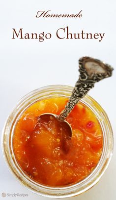 a spoon in a glass jar filled with food